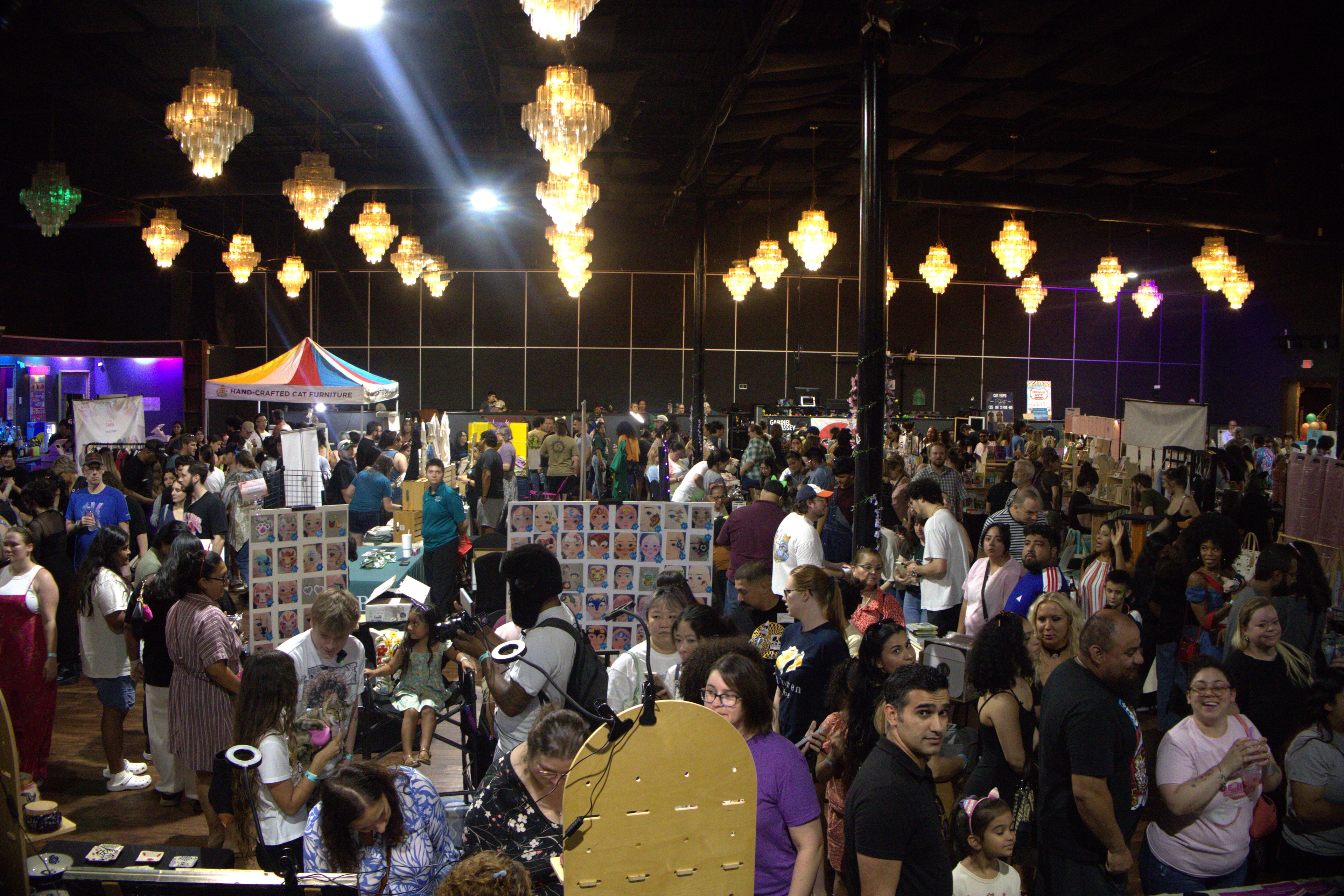A packed house at Houston Cat Expo — vendors, art, and cat lovers everywhere